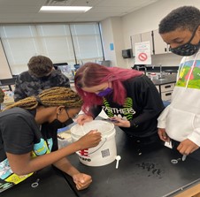 Students conducting a science lab.